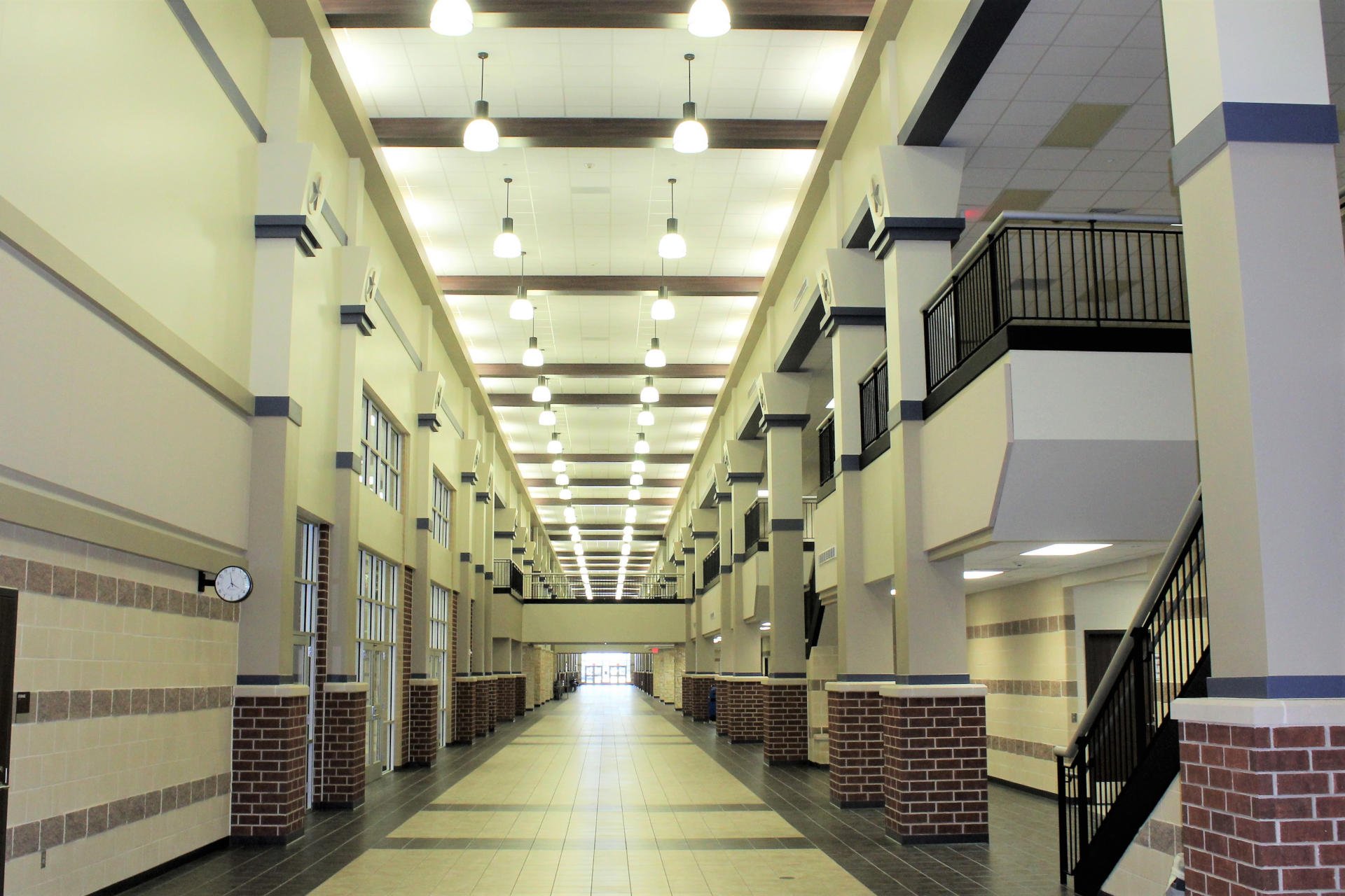 Lamar Consolidated ISD – Churchill Fulshear Jr. - High School & Dean Leaman Junior High SchoolThe Lamar CISD Churchill Fulshear High School and Dean Leaman Junior High School educational complex encompasses a 166 acre site. The approximately 590,000 SF of structures are comprised of a two-story high school, two-story junior high school, a single story athletic field house, single story transportation building, concession stands and ticket booths. Other elements include a competition football field, running track and field events, several football/soccer practice fields, baseball field, softball field, tennis courts, detention pond and extensive concrete paving. All structures are covered with standing seam metal roofing and include striking architectural features such as natural stone accents and expansive main street corridors. Back to Portfolio